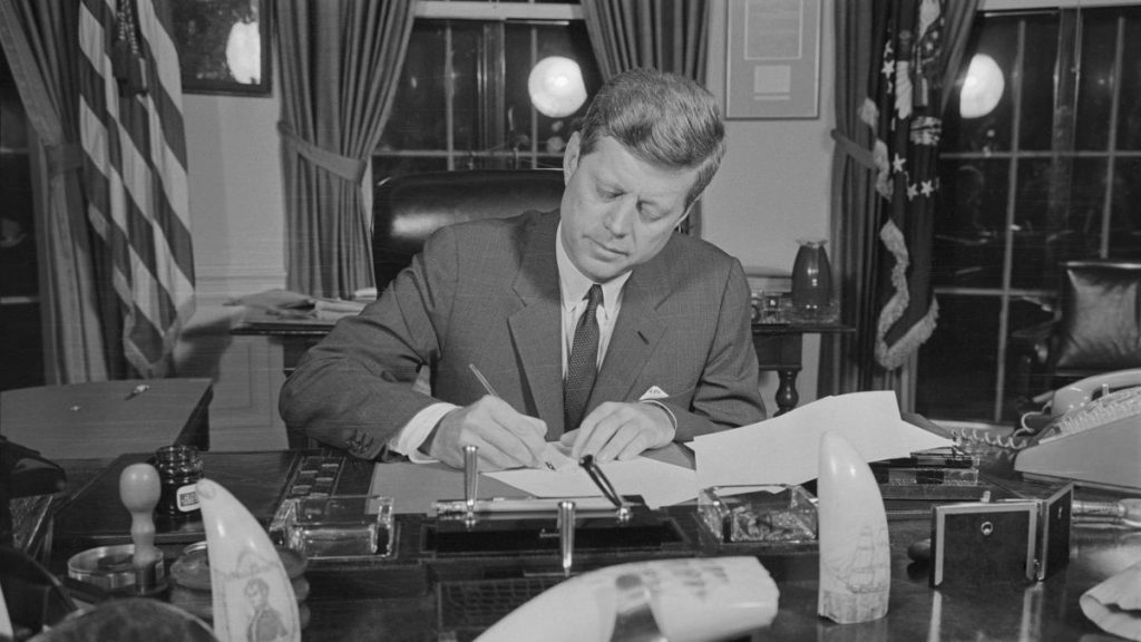 President John F. Kennedy signing the blockade order during the Cuban missile crisis